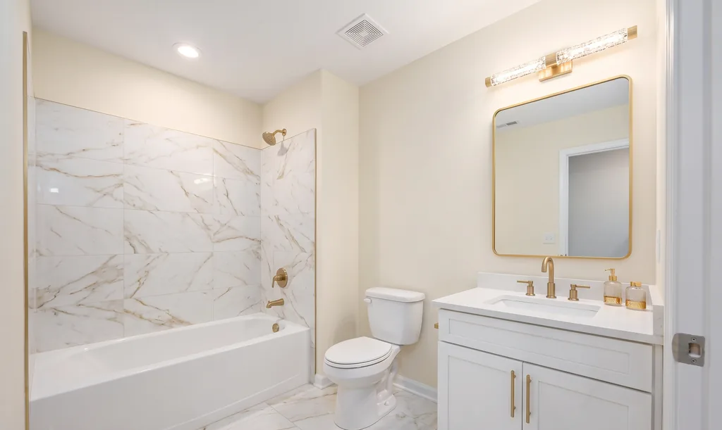 The same bathroom after AI virtual staging in the Modern Glam style